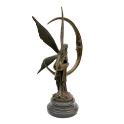 Amazing bronze sculpture of a bronze fairy sitting on the moon