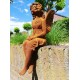 Garden sculpture of a sitting fairy - romantic garden design