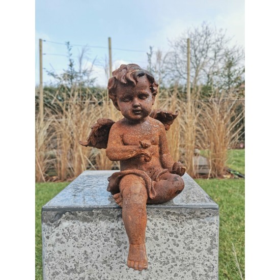 Antique garden sculpture of an Angel (boy) - Sitting model