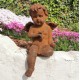 Antique garden sculpture of an Angel (boy) - Sitting model