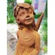 Garden sculpture of a sitting fairy - romantic garden design