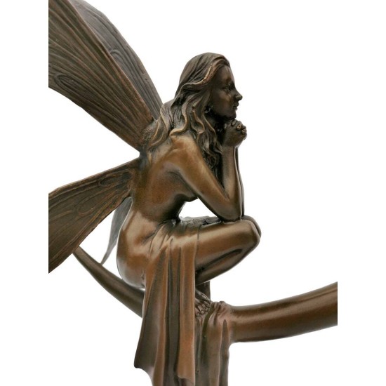 Amazing bronze sculpture of a bronze fairy sitting on the moon