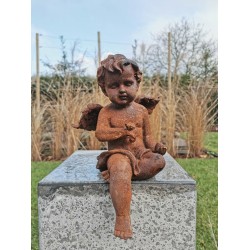 Antique garden sculpture of an Angel (boy) - Sitting model