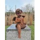 Antique garden sculpture of an Angel (boy) - Sitting model