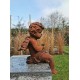 Antique garden sculpture of an Angel (boy) - Sitting model