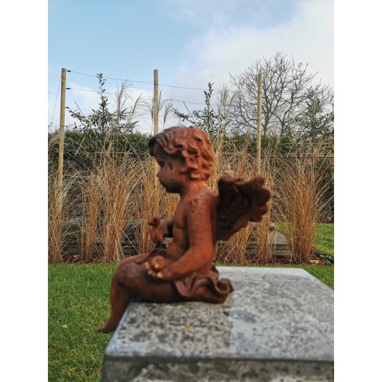 Antique garden sculpture of an Angel (boy) - Sitting model