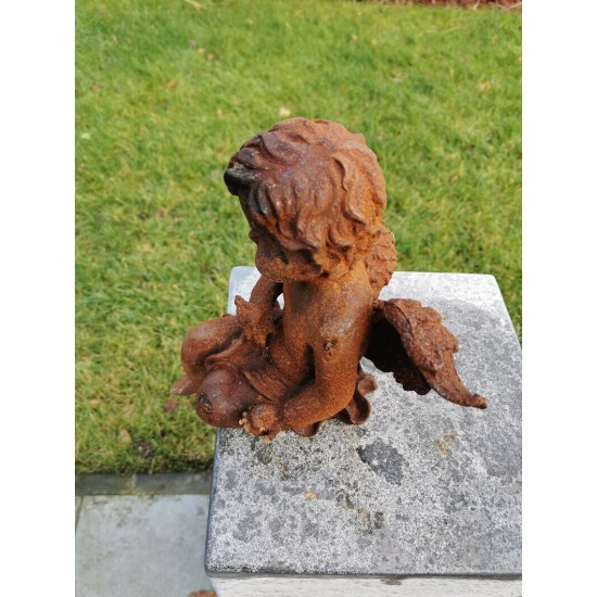 Antique garden sculpture of an Angel (boy) - Sitting model