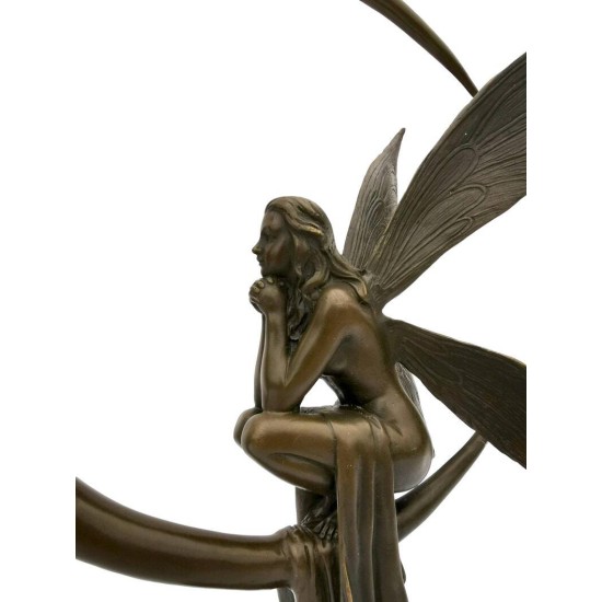 Amazing bronze sculpture of a bronze fairy sitting on the moon
